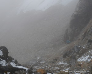 Then the clouds came in during the last ~100m of ascent which was mostly scrambling on loose rock. Can you spot Sudeep?