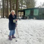 Mom checking out the snow conditions at Camp High Skies